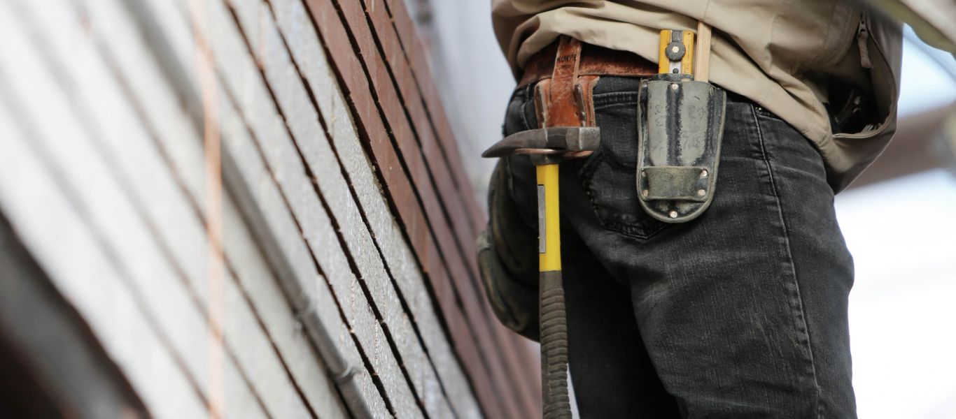 A handyman repairing a roof